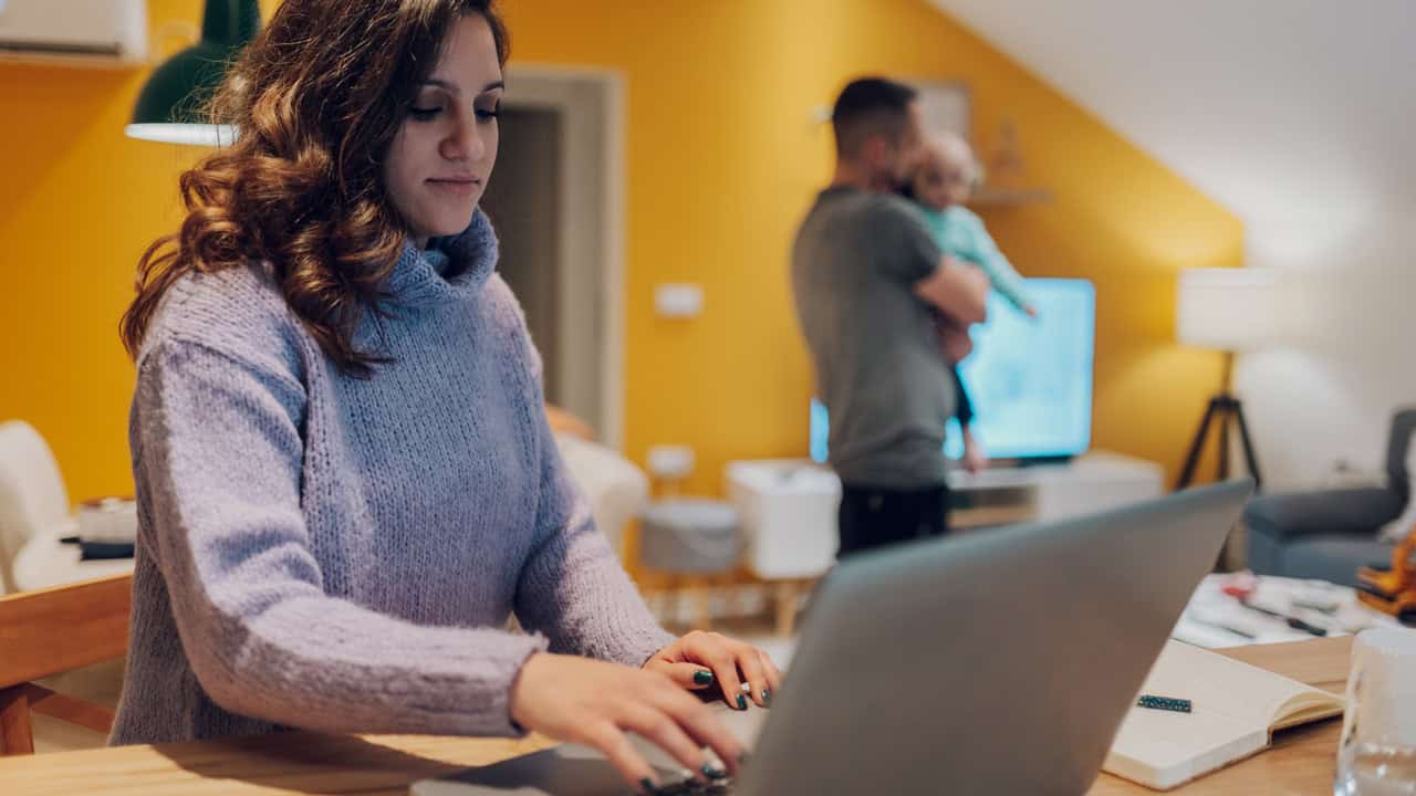 Woman working at home on laptop